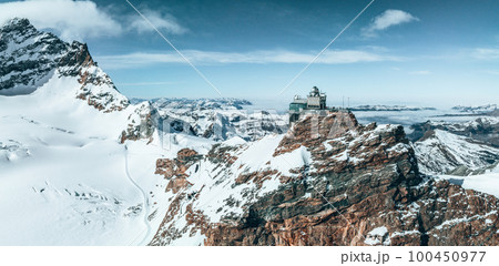 Aerial panorama view of the Sphinx Observatory on Jungfraujoch - Top of Europe, one of the highest observatories in the world located at the Jungfrau railway station, Bernese Oberland, Switzerland. 100450977