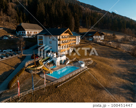 Beautiful luxury Alpine hotel on top of the mountain during spring time. Holiday concept view. Beautiful luxury Alpine hotel on top of the mountain during spring time. Holiday concept view. 100451447