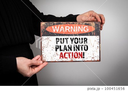 Put your plan into action. Warning sign with text 100451656