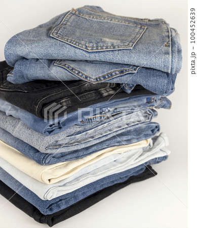 Folded denim pants with pockets to the top. Beauty and fashion clothing concept Folded denim pants with pockets to the top. Beauty and fashion clothing concept 100452639