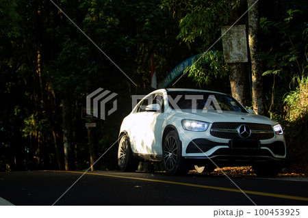Mercedes on a beautiful road Mercedes on a beautiful road 100453925