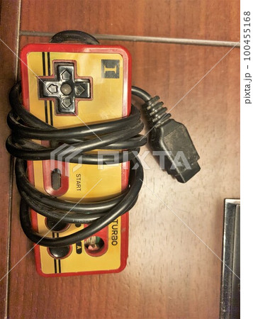 disconnected famicom controller game over the table 100455168