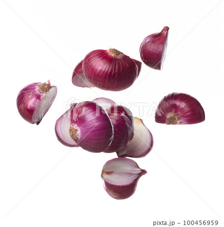 Shallots fall fly in mid air, red fresh vegetable spice shallots onion floating. Organic fresh herbal shallots root head cut chop slice. White background isolated freeze motion high speed shutter 100456959