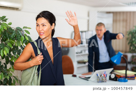 Upset asian female employee manager at working place 100457849