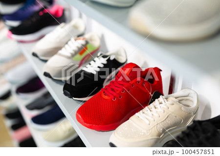 Counter with sports shoes in a store 100457851