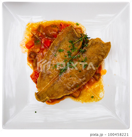 Fried sole fish with herbal oil and stewed vegetables 100458221