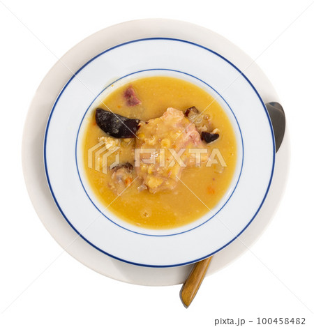 Beautiful serving of pea soup with smoked meat 100458482
