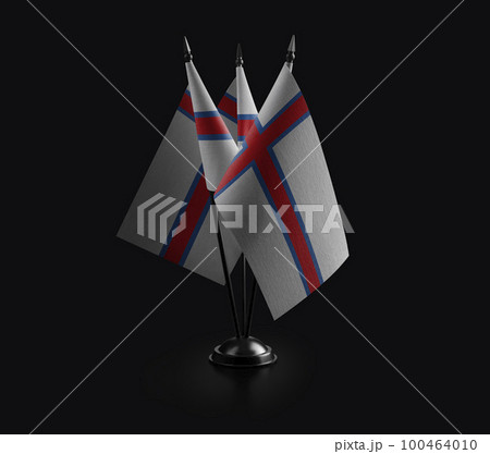 Small national flags of the Faroe Islands on a black background 100464010