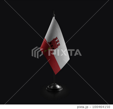 Small national flag of the Gibraltar on a black background 100464150