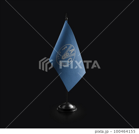 Small national flag of the Food and agriculture organization on a black background 100464155