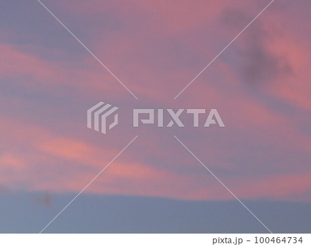 a Dramatic sunrise, sunset pink violet sky with clouds 100464734