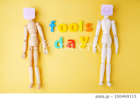 Surprise symbol yellow background. April fool. Joke with laughing face. 100469113