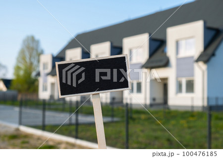 Blank Black billboard against apartment family house Empty mockup template Blackboard label at Townhome. Copy space banner for your text. Multi-family House Concept of rent, price house, buying house Blank Black billboard against apartment family house Empty mockup template Blackboard label at Townhome. Copy space banner for your text. Multi-family House Concept of rent, price house, buying house 100476185