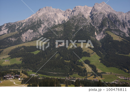 Beautiful scenic view of the Mountains with a cloudy sky near Leogang in Austria 100476811