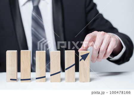 Wooden blocks with black arrow icons, business profit growth success concept 100478166