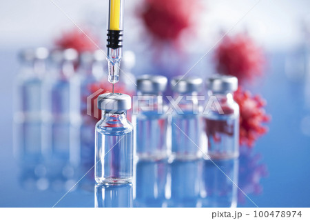 Close up medical syringe with a vaccine Close up medical syringe with a vaccine 100478974