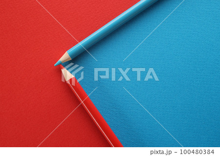 Blue and red pencils on red and blue background Blue and red pencils on red and blue background 100480384