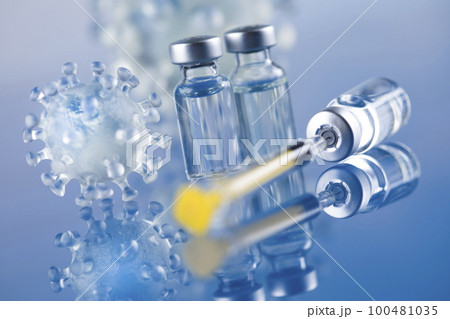 Close up medical syringe with a vaccine Close up medical syringe with a vaccine 100481035