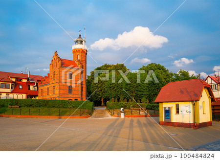 2022-06-02 square in front of baltic sea lighthouse in ustka town on the sunset. ustka, poland 100484824
