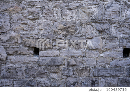 Stone wall structure of an old house 100489756