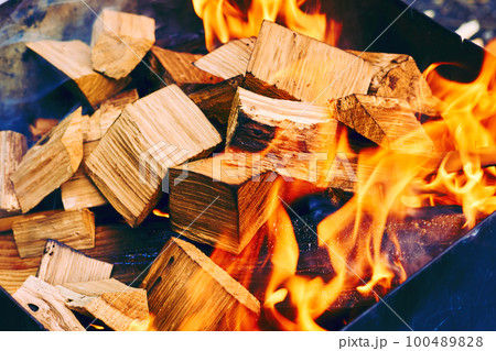 Wooden blocks firewood fuel thrown into the brazier for kindling for cooking Wooden blocks firewood fuel thrown into the brazier for kindling for cooking 100489828