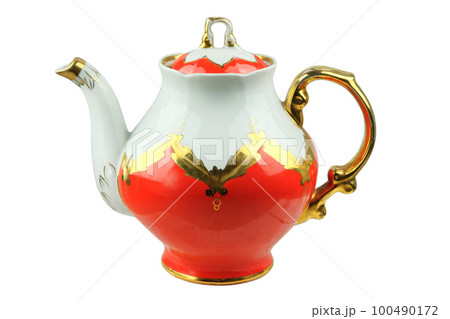 Porcelain teapot isolated on a white background. Tea pot with patterns. 100490172