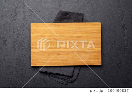 Wooden cutting board and kitchen towel 100490837