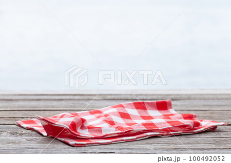 Wooden table with tablecloth Wooden table with tablecloth 100492052