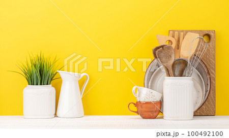 Kitchen utensils on wooden table 100492100
