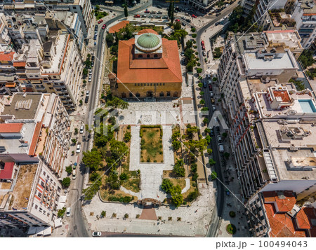 Thessaloniki, Greece aerial drone view of Hagia Sophia Byzantine church, a Christian Orthodox UNESCO World Heritage Site surrounded by buildings. 100494043