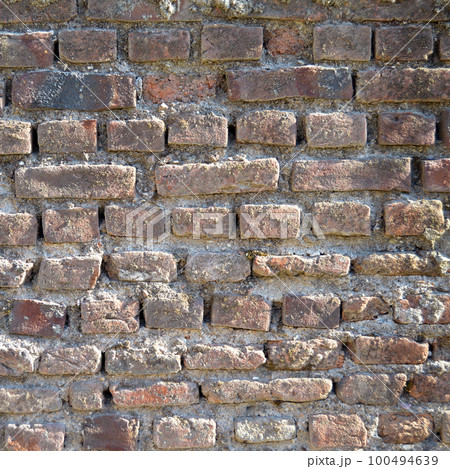 Old red brick wall vintage texture, brick wall close up texture Old red brick wall vintage texture, brick wall close up texture 100494639