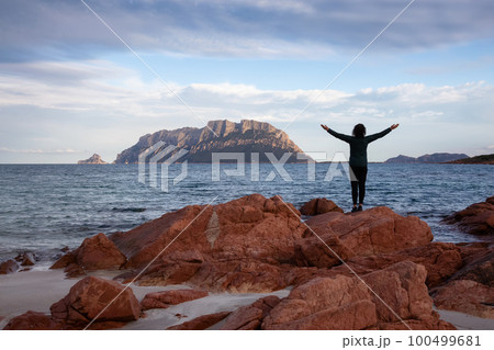 Rocky and Sandy Beach in Porto Istana, Sardinia, Italy. Tavolara Island in Background. 100499681