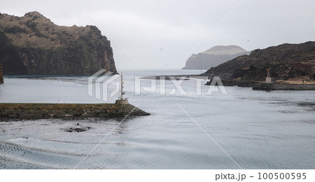 Landscape with the breakwater at the entrance of Vestmannaeyjar Landscape with the breakwater at the entrance of Vestmannaeyjar 100500595