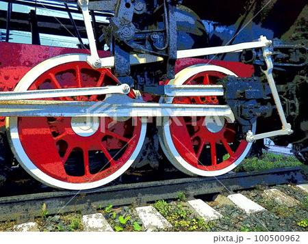 Retro vintage wheels of a locomotive or train close up. Red large heavy metal wheels with piston guiding mechanisms. Locomotive of the 19th - 20th centuries with a steam engine. Bright vivid photo 100500962