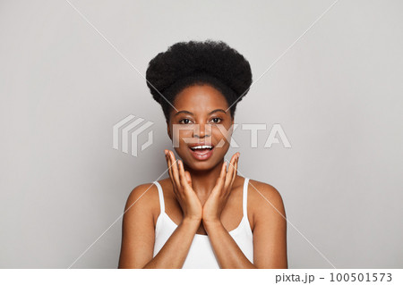 Happy excited cheerful surprised brunette model woman looking at camera  100501573
