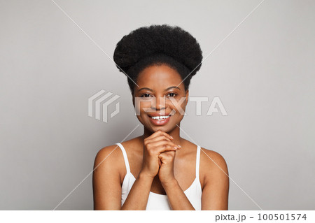 Cute young brunette model woman with clean healthy fresh dark skin smiling against white studio Cute young brunette model woman with clean healthy fresh dark skin smiling against white studio 100501574