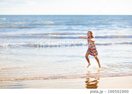Kids play on tropical beach. Sand and water toy. Kids play on tropical beach. Sand and water toy. 100502800
