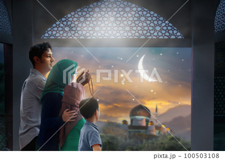 Ramadan Kareem greeting. Family looking at mosque. Ramadan Kareem greeting. Family looking at mosque. 100503108