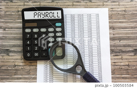 PAYROLL word on calculator. Business and financial concept PAYROLL word on calculator. Business and financial concept 100503584