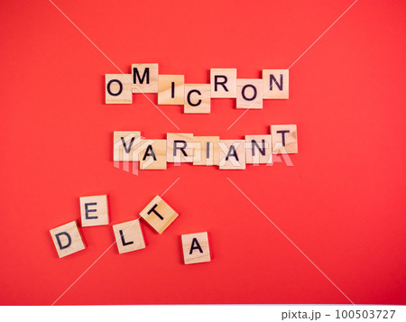 Omicron variant replaces Delta. Emergence of new dangerous strain of coronavirus COVID-19 Omicron. Words omicron variant delta on colored red background 100503727