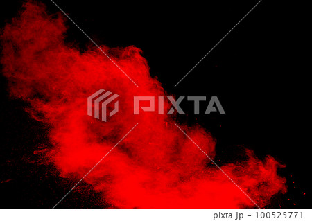 Red powder explosion cloud on black background. Freeze motion of red color dust  particles splashing. 100525771