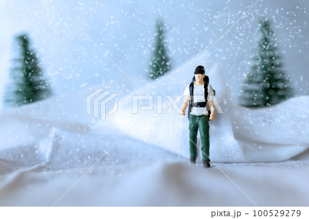 Miniature people Backpacker Travel in winter time 100529279