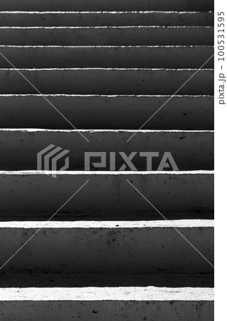 Concrete stairs with dark shadows, abstract vertical photo 100531595