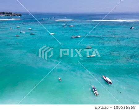 Aerial view of tourist speedboat anchored at Nusa Lembongan Aerial view of tourist speedboat anchored at Nusa Lembongan 100536869