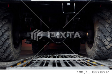 Close up view of fire truck's wheels. Photo from below. Natual lighting 100540912