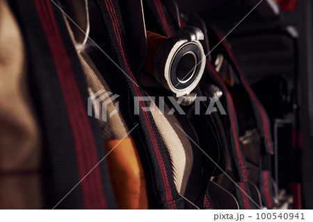 Firefighter's equipment in the car. Hoses hanging inside of vehicle Firefighter's equipment in the car. Hoses hanging inside of vehicle 100540941