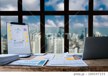 workspace area with laptop tablet smartphone and paperwork on the table in the office concept. workspace area with laptop tablet smartphone and paperwork on the table in the office concept. 100547155