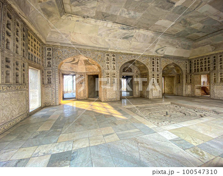 The famous red fort in the city of Agra, India. Tourists visit a popular tourist attraction. 100547310