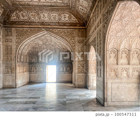 The famous red fort in the city of Agra, India. Tourists visit a popular tourist attraction. 100547311