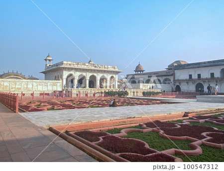 The famous red fort in the city of Agra, India. Tourists visit a popular tourist attraction. 100547312